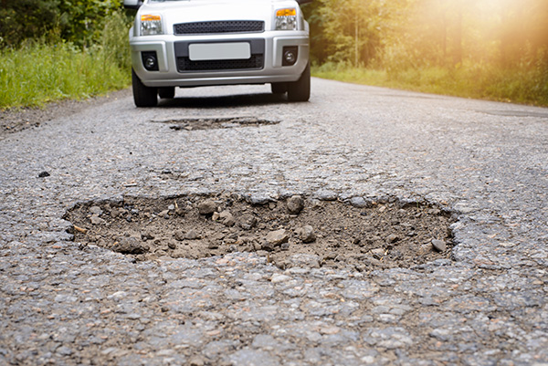 How Colorado Potholes Are Wrecking Your Car's Alignment This Spring | South Denver Automotive